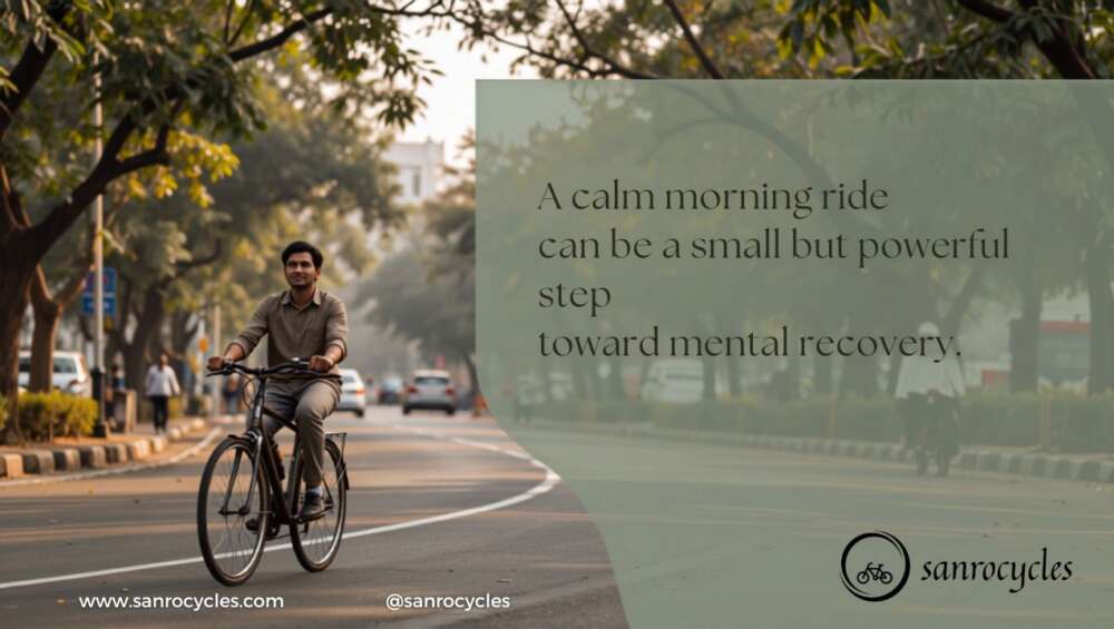 Adult cycling on a tree-lined Pune road during morning light for mental recovery