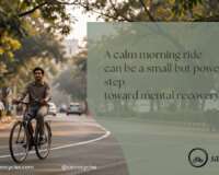 Adult cycling on a tree-lined Pune road during morning light for mental recovery