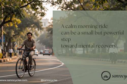 Adult cycling on a tree-lined Pune road during morning light for mental recovery