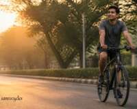 Cyclist riding a hybrid bicycle comfortably on a Pune road at sunrise