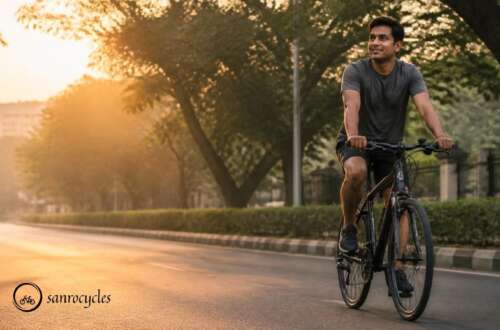 Cyclist riding a hybrid bicycle comfortably on a Pune road at sunrise